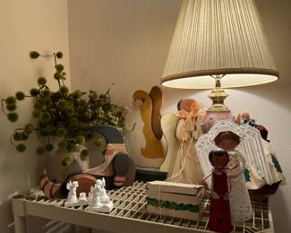 Pink lamp with shade to right, collectible Angels, and more