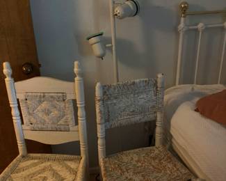 2 wicker chairs, standing lamp and headoard