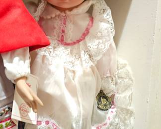 late 20th-century porcelain doll with dark hair and blue eyes.