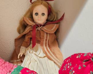 Vintage Effanbee composition or plastic doll with blonde hair and fixed eyes.