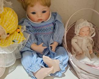 A 1992 Ashton Drake "Hannah Needs A Hug" porcelain collectible doll.