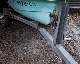 Vintage skiff boat and trailer.