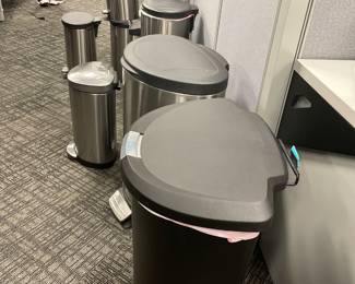a group of garbage cans