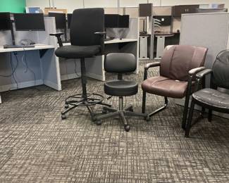 Five miscellaneous chairs, including a nice rolling stool and a nice lab chair with arms