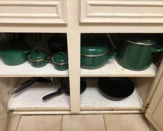 Green Le Creuset pot (top shelf far left)