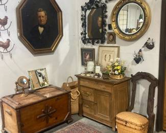 Rustic trunk, small cabinet, mirrors, iron birds and metal hens