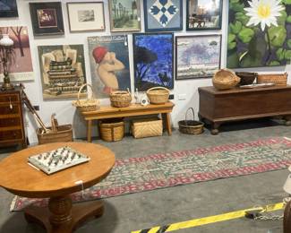 Wood pedestal coffee table, art work, baskets, cedar chest