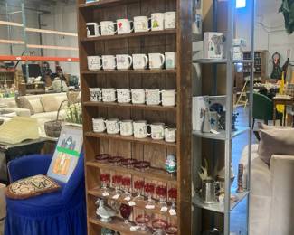 Shelves full of coffee cups, wine glasses, and accessories