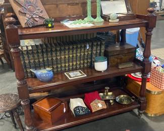 Three shelf wood display piece with lots of accessories