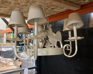 Cream colored metal chandelier with animals and shades