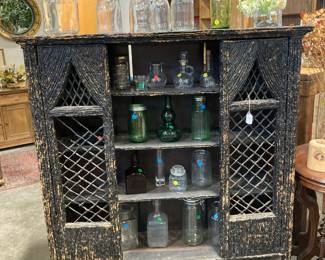 Timber cabinet, glass bottles