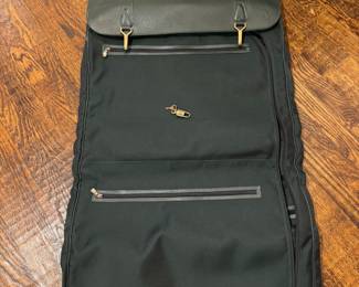 Louis Vuitton vintage garment bag with 4 inside pockets. Includes Louis Vuitton stamped lock and 3 hangers.