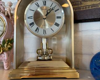 Vintage Seiko gold tone mantel clock with rotating pendulum