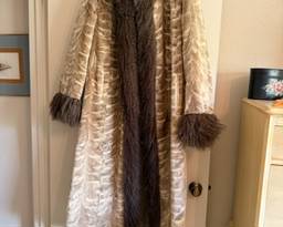 Sensational authentic fur coat is reversible and changes into a trench coat with trendy belt. A MUST SEE!