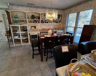 Entertainer's dream - loads of vintage pitchers and glasses along with lots of selection in depression glass. Bar height kitchen table with 6 swivels chairs in good condition.