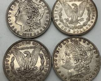 Four 1879 Silver Dollars