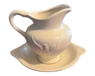 Hull USA cream ceramic pitcher and saucer with eagle design. Circuit 1940s to 1950s.