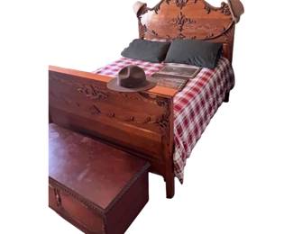 Antique Victorian carved oak queen size bed frame with ornate detailing. Circuit 1890 through 1910.