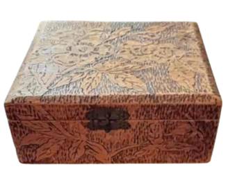 A Flemish pyrography wood box with floral carvings and
engraved "Flemish 688". Circa 1900