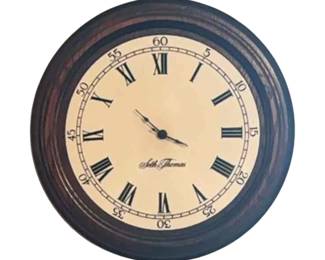 Vintage Thomas battery operated wall clock with Roman numerals. Circa 1970s to 1980s.