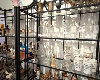 Wide range of antiques glass, bottles, and apothecary items.