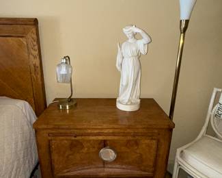 Wooden nightstand with three drawers (part of a larger bedroom set)