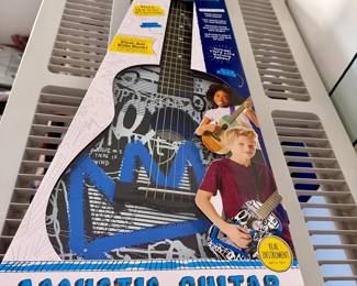 First Act Discovery 30-inch acoustic guitar with a graffiti design