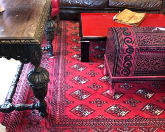 This large hand made Oriental carpet has a large hole on one end-under the sofa left. Leather sofa is sold