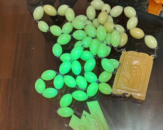 look how beautifully this large prayer bead rosary glows under a black light!