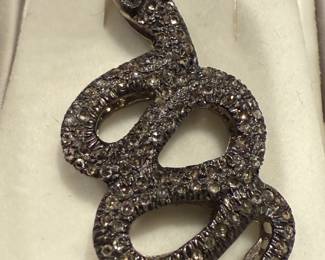 Vintage sterling silver pave, diamond, and ruby eyed snake pendant