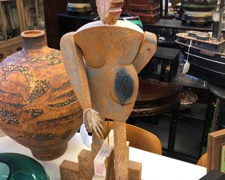 Wood figure carved on both sides: Coming & Going by Beth Goshorn 