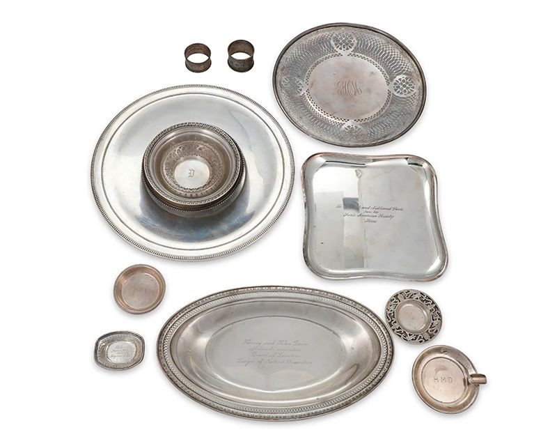 3001
A group of sterling silver table items
20th century
One marked for .900 silver, most of the rest marked for sterling and variously for maker
Comprising plates, bowls, ashtrays, and napkin rings, most monogrammed
14 pieces
Largest plate: 12.125" Dia.
Total weight: 60.1 oz. troy approximately
Estimate: $1,200 - $1,800