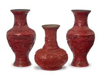 3136
Three Chinese cinnabar-style vases
20th century
Comprising a near pair of lacquered wood baluster vases, each depicting figures within a mountainous scene, and a lacquered metal vase with globular base depicting birds in an arboreal scene
3 pieces
Near pair: 9.25" H x 5" Dia.; Globular: 7" H x 5.375" Dia.
Estimate: $300 - $500