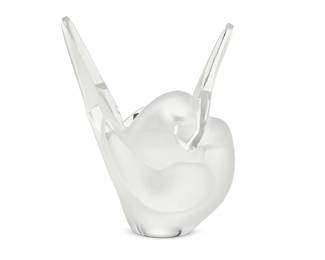 3027
A Lalique glass 'Sylvie' vase
Late 20th century
Etched to underside: Lalique ® France [post-1978]; with factory sticker
In the form of two conjoined doves, including glass frog insert
8.5" H x 7" W x 4.25" D
Estimate: $300 - $500