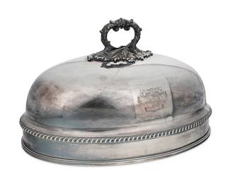 3055
An English Sheffield silver-plated meat dome
19th century
Bearing two armorial crests for Rhodes "Robor Meum Dues" (Strength Through God)
With foliate-form handle
9.75" H x 16.5" W x 11.75" D
Estimate: $500 - $700