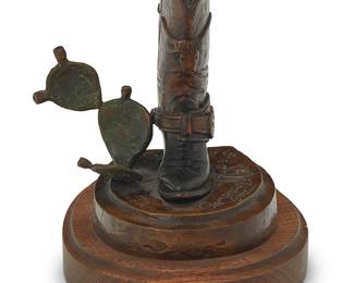 3062
Armando Sotelo
(20th/21st century)
"Cowboy's Dream Boot," 2002
Patinated bronze on wood plinth
Edition: 3/20
Signed, dated, numbered, and inscribed in the casting: Armando Sotelo / II / [bull cipher] / © / USA / Tucson Arizona; titled to metal plaque applied to plinth
Bronze: 6.625" H x 5.625" W x 6" D; Overall: 7.5" H x 6.25" W x 7" D
Estimate: $200 - $300