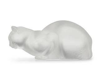 3029
A Lalique glass 'Chat Couche' figure
Late 20th/early 21st century
Designed 1932 by René Lalique (1860-1945)
Etched: Lalique ® France [post-1978]
4.375" H x 9.25" W x 4.625" D
Estimate: $200 - $300