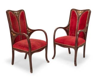 3072
A pair of Art Nouveau carved wood armchairs
Early 20th century
Each crest rail and armrest support with gilt foliate openwork accents, upholstered in high pile velvet fabric with brass tacking at seatback, seat, and verso
2 pieces
Each: 42.25" H x 23.25" W x 26" D
Estimate: $600 - $800