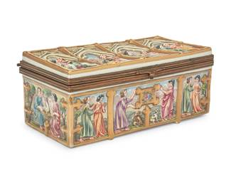 3041
A Capodimonte-style porcelain box
20th century
Marked with blue crown and Naples 'N'; further marked: Made in France
The lidded box with gilt metal hinges and trim, featuring molded, polychrome painted, and gilt figural scenes in friezes
3.5" H x 8.5" W x 4.5" D
Estimate: $300 - $500