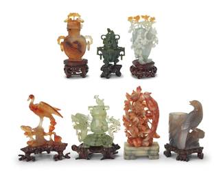 3172
A group of Chinese hardstone carvings
20th century
Comprising a nephrite diminutive censer with ring accents, a chalcedony bud vase with bird, a jade lidded fruit with leaves and butterflies, a carnelian phoenix, a jade Bixi with lidded urn, a carnelian urn with ring accents, and a hardstone phoenix depicted in a tree
7 pieces
Jade fruit: 4.125" H x 2.75" W x 2.375" D; Carnelian phoenix: 4.625" H x 3.625" W x 2.25" D
Estimate: $200 - $400