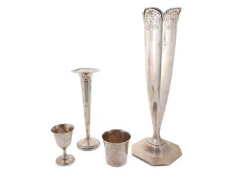 3020
Three sterling silver trophies and a vase
20th century
Each marked for sterling and various makers
Comprising an International cup, a Wallace footed cup, an M. Fred Hirsch Co. weighted sterling vase, and a Frank M. Whiting Co. pierced flower vase, each personally inscribed
4 pieces
Largest: 10.25" H x 3.625" Dia.; Shortest cup: 3.25" H x 3.375" Dia.
Total weighable sterling: 25.4 oz. troy approximately
Estimate: $600 - $800