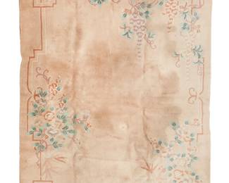 3068
A Chinese carpet
20th century
Wool on cotton foundation with light pink and purple flowering vines around a band work border on a champagne field
10' 1.5" L x 8' W
Estimate: $300 - $500