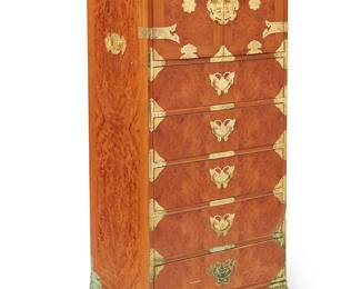 3261
A Contemporary Korean burlwood chest
Late 20th century
The chest with gilt metal hardware, opposed handles, and butterfly escutcheons, featuring an upper component with hinged locking cabinet doors revealing six small drawers, above five larger drawers below, raised on ogee bracket feet
52.25" H x 23.5" W x 16.75" D
Estimate: $300 - $500