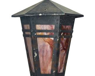 3334
An Arts & Crafts-style iron and slag glass ceiling lamp
20th century
The enameled iron single-light lamp with lavender slag glass panels, electrified
Without chain and escutcheon: 19.5" H x 16.5" W x 14.25" D; Overall: 26.5" H
Estimate: $100 - $150