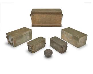 3256
A group of Philippine metal boxes
19th/20th century
Likely betel boxes, comprising three with incised designs and two with inlaid silver revealing interior lidded compartments, together with a Burmese sterling silver betel box
6 pieces
Largest: 6.375" H x 13.5" W x 7.625" D; Burmese: 2.5" H x 3" Dia.
Weighable sterling: 1.3 oz. troy approximately
Estimate: $600 - $800