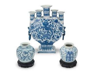 3113
Three Chinese blue and white porcelain vessels
Late Qing Dynasty (1644-1912) and later
Tulipiere bearing an apocryphal reign mark for Qianlong Period (1736-1795) and further numbered and inscribed: Ch'ien-Lung Reproduction / Circa 1736-1795 / Hh Hong Horizons / Limited Edition: 7/500
Comprising a five-spouted tulipiere with opposed ring handles, decorated with dragon and flaming pearl motifs, and a near-pair of Double Happiness jars set in wood stands
3 pieces
Tulipiere: 11.75" H x 9.5" W x 4" D; Each jar: 4" H x 4" Dia.
Estimate: $400 - $600
