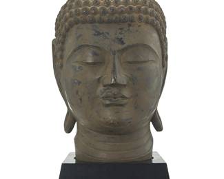 3234
An Asian-style carved wood head of Buddha
20th/21st century
Antiqued enameled hardwood set on a wood base
Head: 9.25" H x 11.5" W x 13.5" D; Base: 4.25" H x 11" W x 12" D
Estimate: $400 - $600
