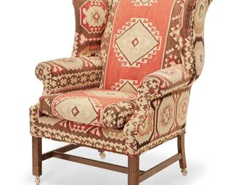 3108
A George III-style wingback armchair
20th century
The wood frame with Kilim-style woven upholstery, raised on casters
44" H x 36" W x 36.5" D
Estimate: $400 - $600