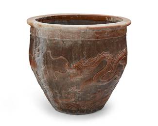 3259
An East Asian ceramic jardinière
19th century or later; China or Southeast Asia
The brown glazed jardinière depicting a dragon figure and flaming pearls above a roiling sea in relief
19.5" H x 22.75" Dia.
Estimate: $300 - $400