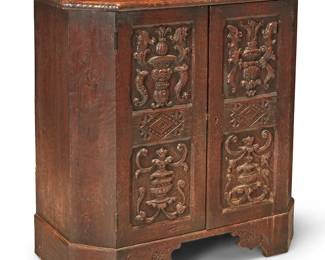 3331
A Marshall Laird Spanish Revival cabinet
Circa 1920s
With metal tag to door interior: Marshall Laird / Los Angeles
The locking cabinet doors with carved urns and bird motifs, revealing a single shelf
32.5" H x 31" W x 15.5" D
Estimate: $300 - $500